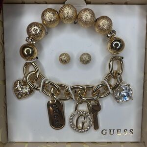 Mother’s Day’s Gift 
GUESS Gold Charm Bracelet and Earring Set